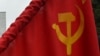 KYRGYZSTAN -- A woman holds a flag of the USSR during a rally of Kyrgyz communist supporters to pay their respects to Soviet Union founder and revolutionary leader Vladimir Lenin to mark the 151st anniversary of his birth, in central Bishkek, April 22, 20